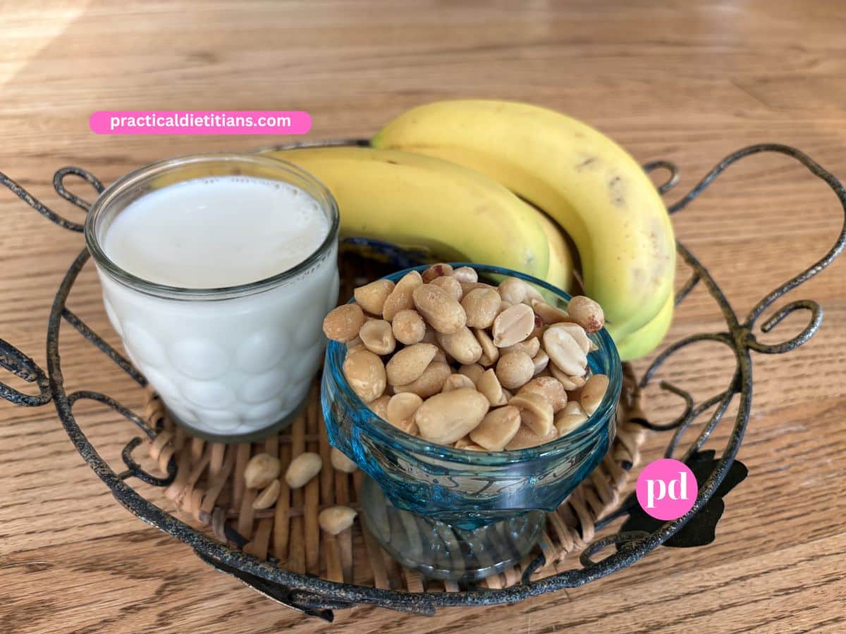 straw bowl holding bananas milk and peanuts