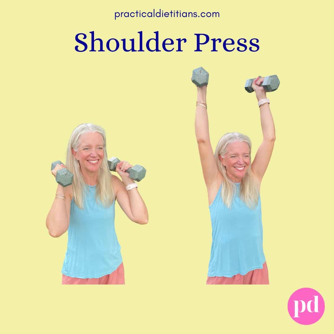 female demonstrating shoulder press exercise